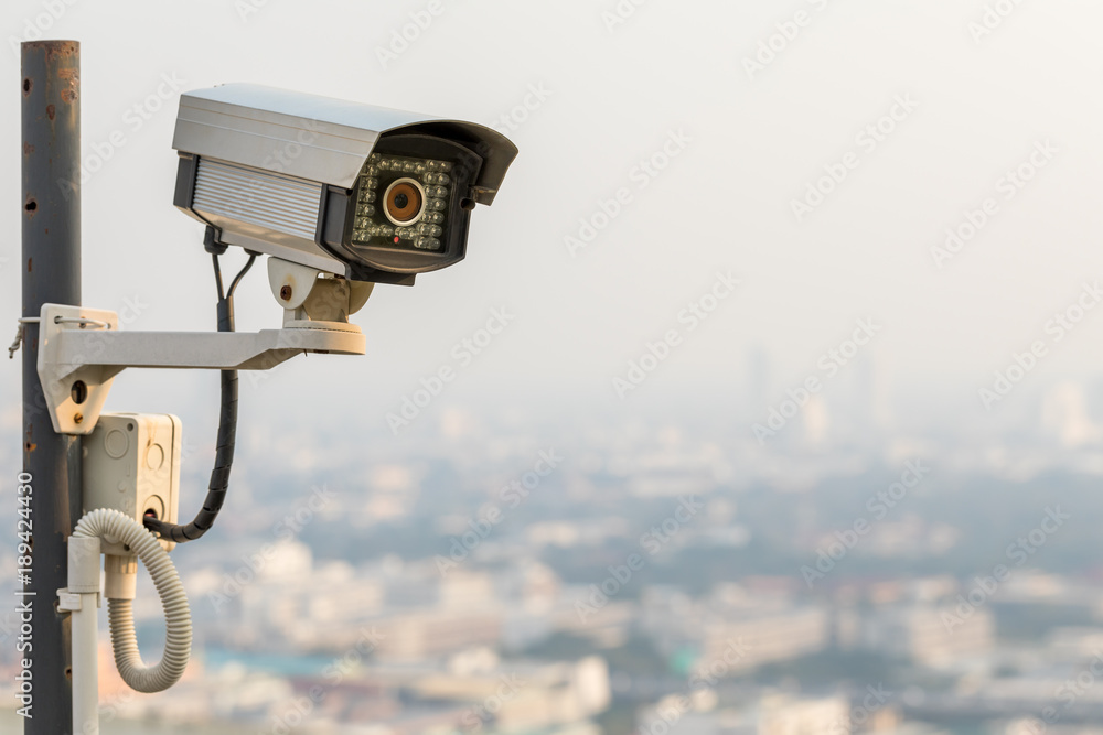 Security CCTV camera in cityscape with sunset at Bangkok, Thailand. Copy space Security CCTV camera in cityscape with sunset at Bangkok, Thailand. Copy space