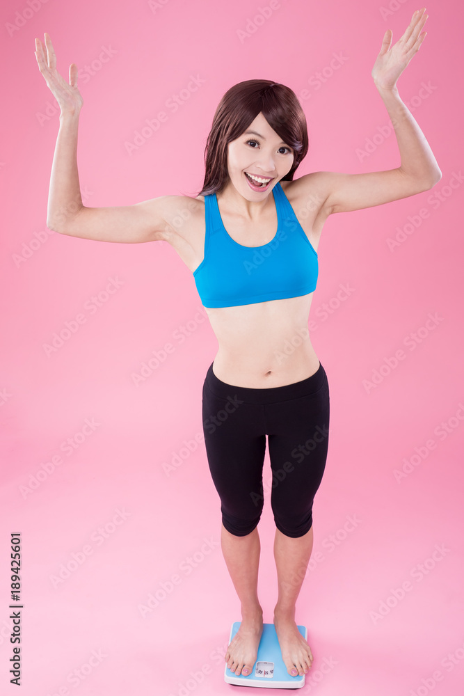 woman stand on weight scale woman stand on weight scale