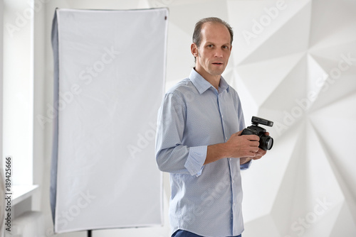 Young photographer in studio photo
