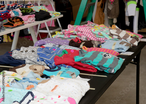 Canvas Print Colorful children's pajamas a suburban yard sale