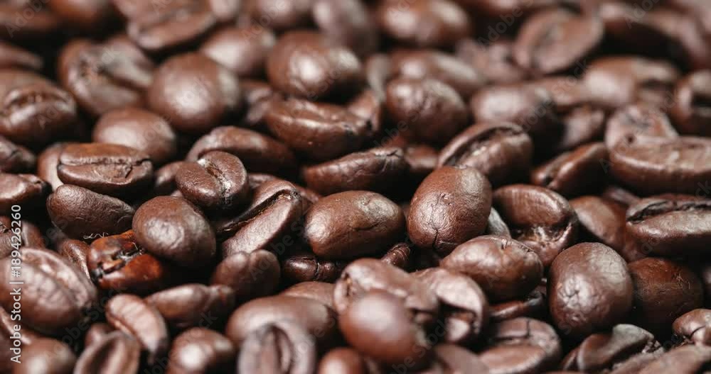 Roasted coffee bean in rotation Roasted coffee bean in rotation