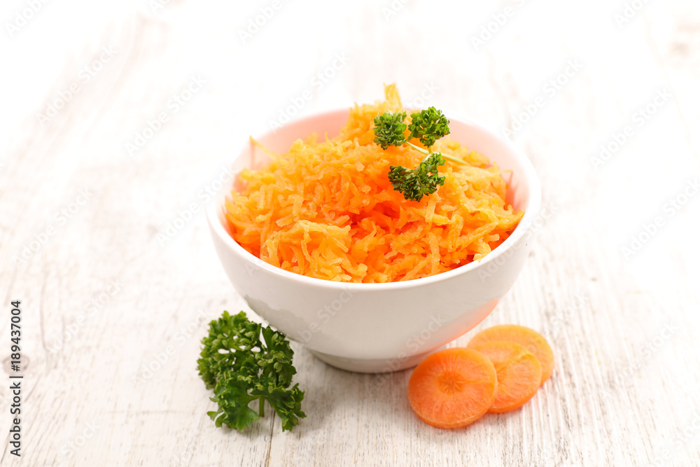 bowl of grated carrot bowl of grated carrot