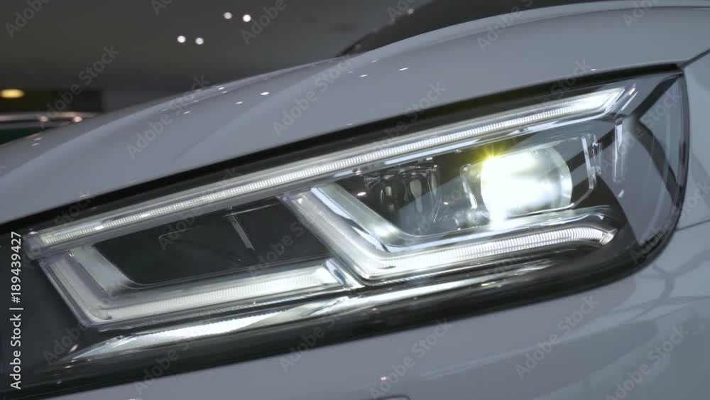 Modern car, view of car headlight, diode lamp glow, motion.
Modern car, view of car headlight, diode lamp glow, motion.