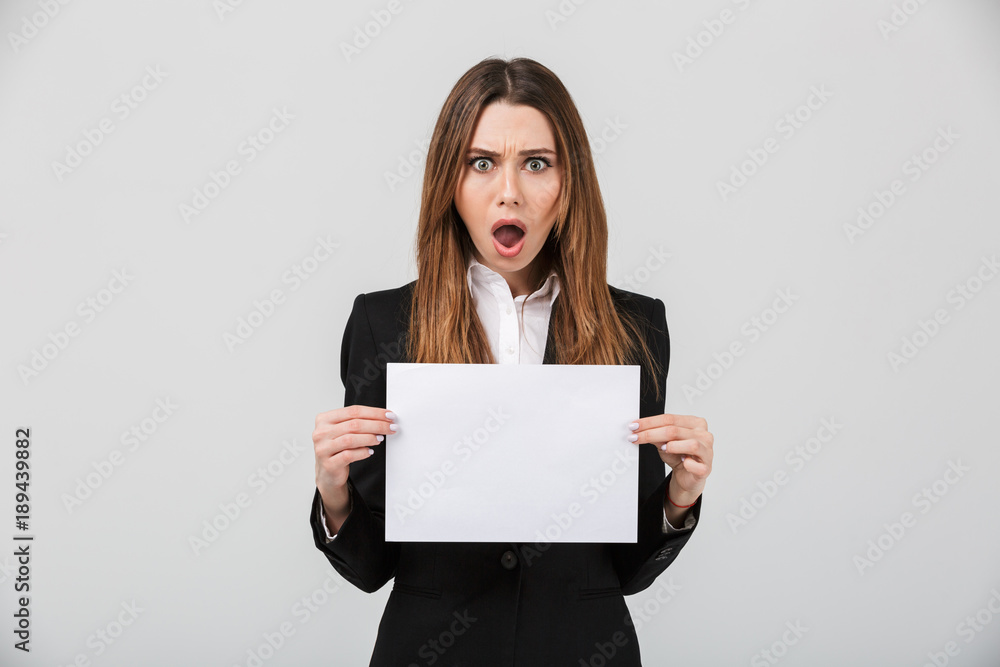 Portrait of a shocked businesswoman dressed in suit Portrait of a shocked businesswoman dressed in suit