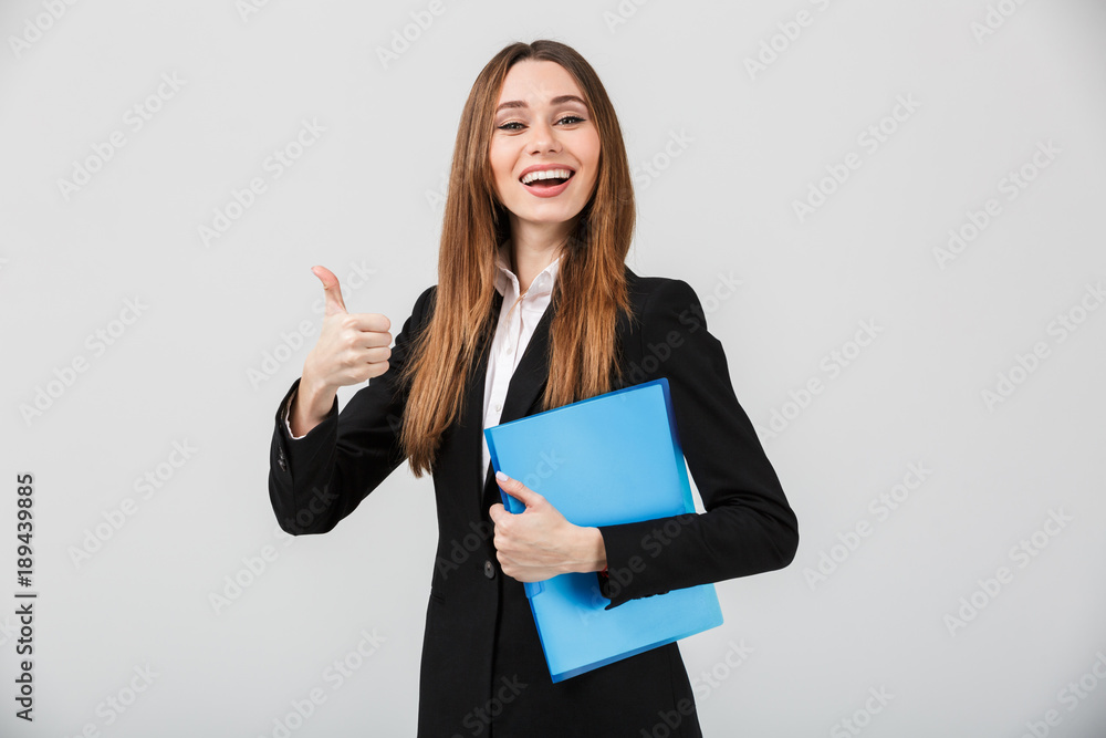 Portrait of a cheerful businesswoman dressed in suit Portrait of a cheerful businesswoman dressed in suit