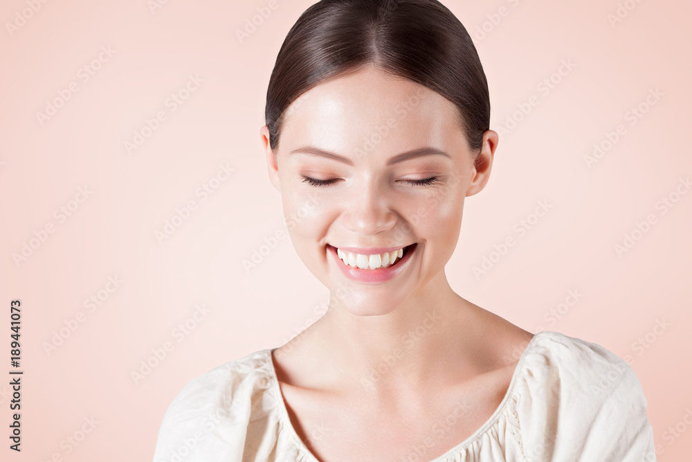 Young smiling woman with clean perfect skin close-up Young smiling woman with clean perfect skin close-up
