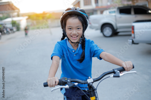 child girl with folding bike.