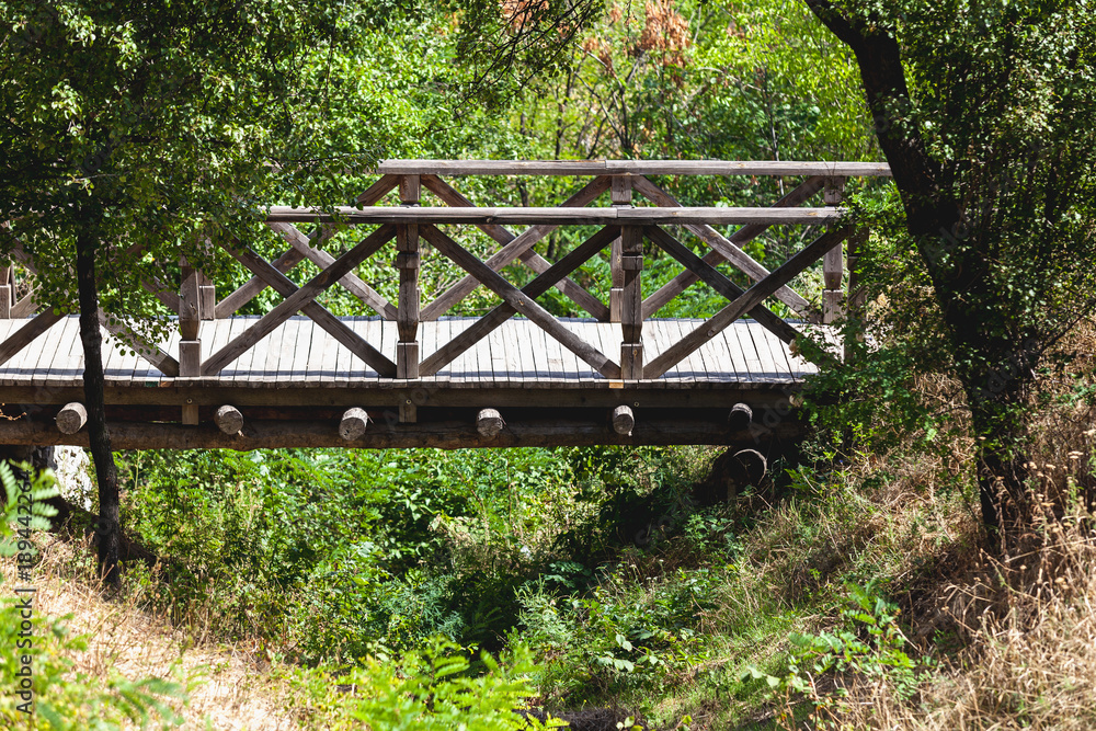 Wooden bridge over a deep ravine