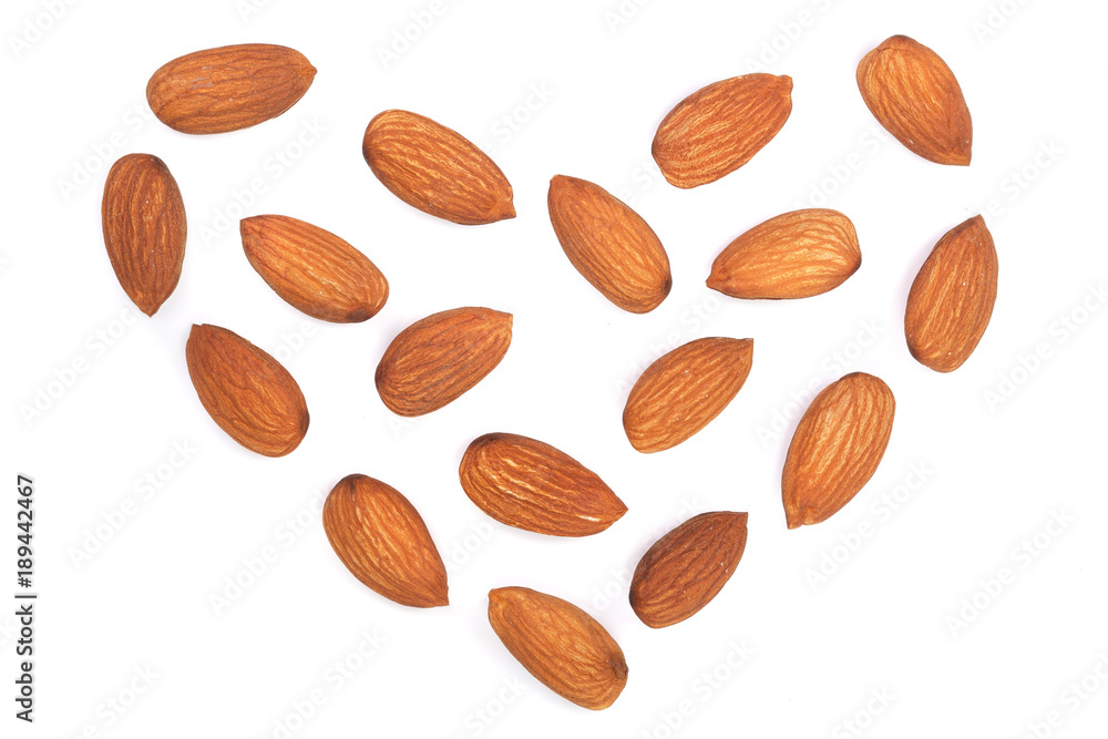 almonds in the shape of a heart isolated on white background. Top view. Flat lay pattern almonds in the shape of a heart isolated on white background. Top view. Flat lay pattern