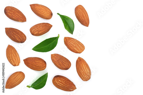 almonds with leaves isolated on white background with copy space for your text. Top view. Flat lay pattern