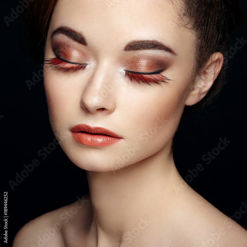 Beautiful woman face. Creative makeup. Beauty fashion. Eyelashes. Cosmetic Eyeshadow