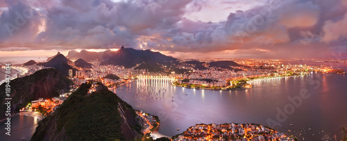 Spectacular aerial view over Rio de Janeiro at sunset. Viewed from mountain peak.