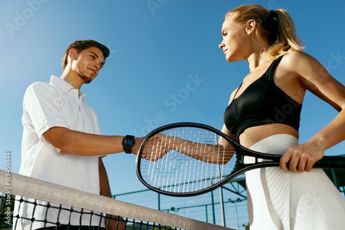 Tennis. Man And Woman Shake Hands Before Playing Tennis © puhhha