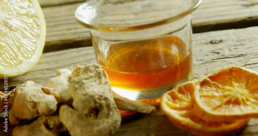 Herbal tea with ginger and lemon on wooden table Herbal tea with ginger and lemon on wooden table