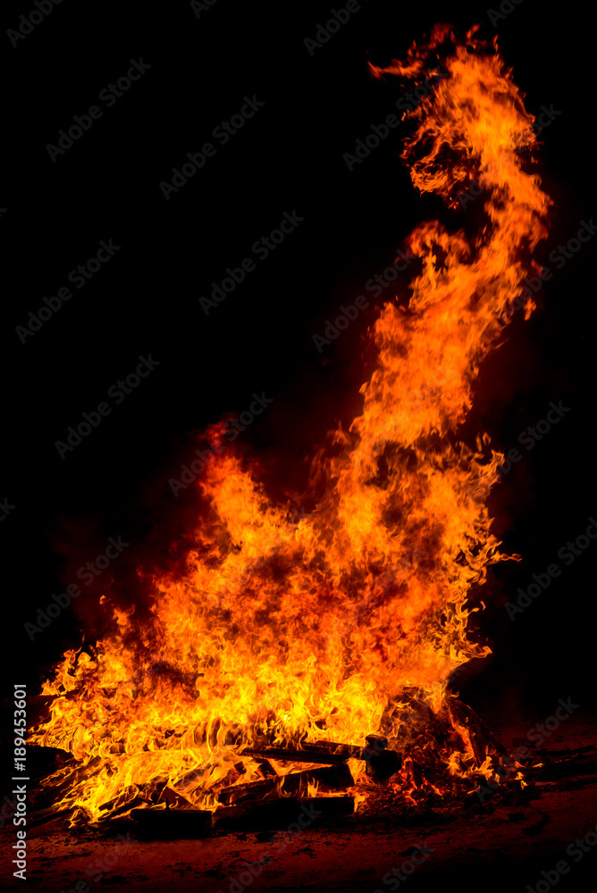 sparks of big bonfire on dark background