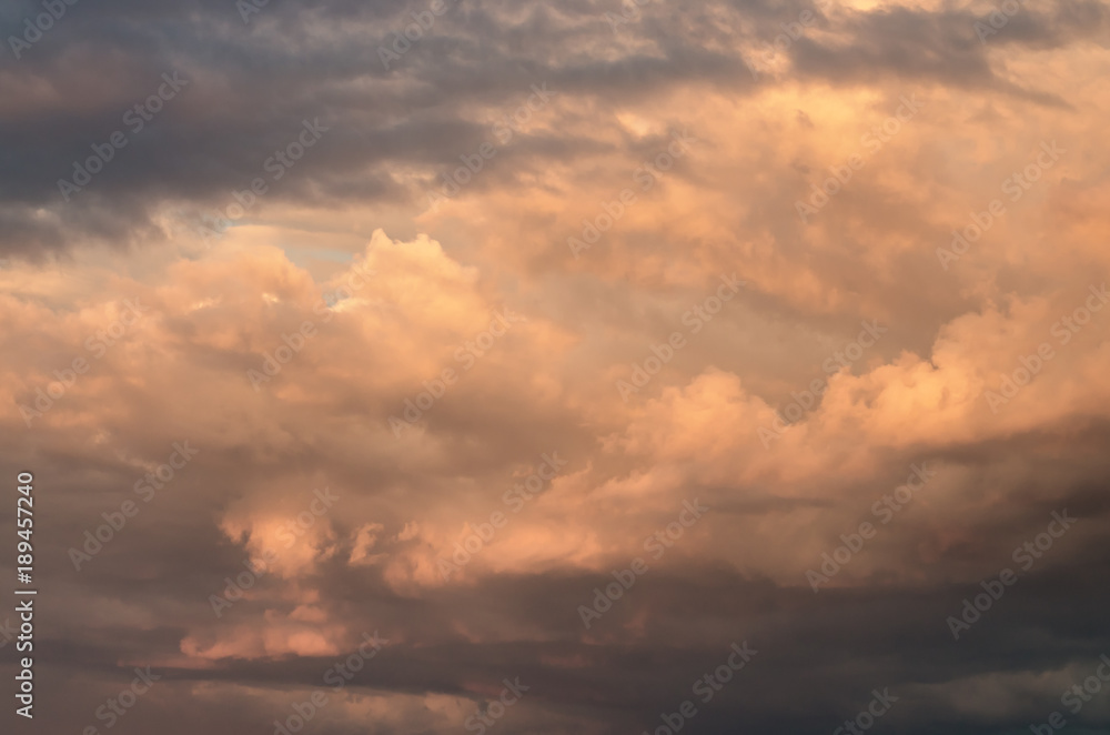 storm clouds in the sky, illuminated by the evening sun. Beautiful natural background.
