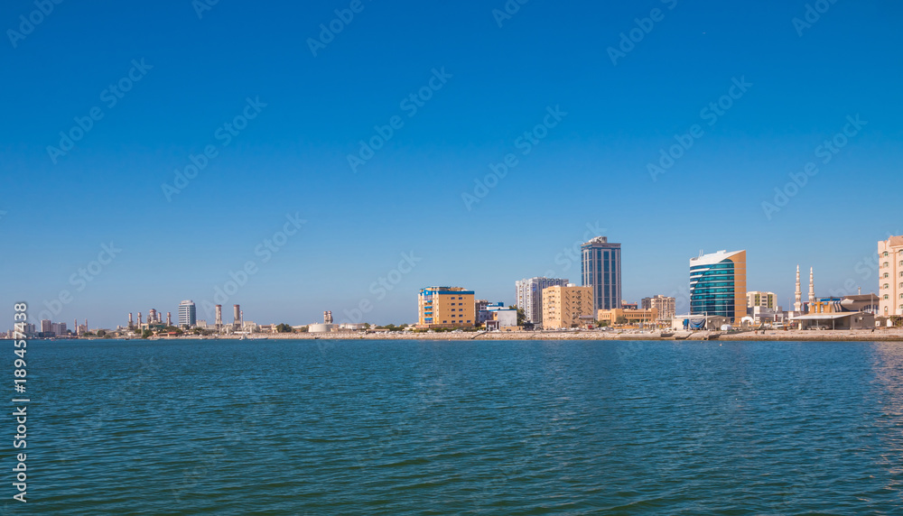 Fototapeta premium Ras Al Khaimah during sunny day . View to beautiful bay with harbour in background