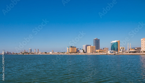 Ras Al Khaimah during sunny day . View to beautiful bay with harbour in background © johnkruger1