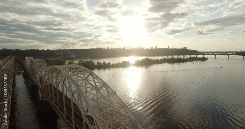 Wallpaper Mural Kiev. Ukraine. The bridge across the Dnieper River Winter. Span over the city with a bird's-eye view at sunset Lonza. The city of Kiev is on the Dnieper River. Flying in Kiev on the Dnieper river . Torontodigital.ca