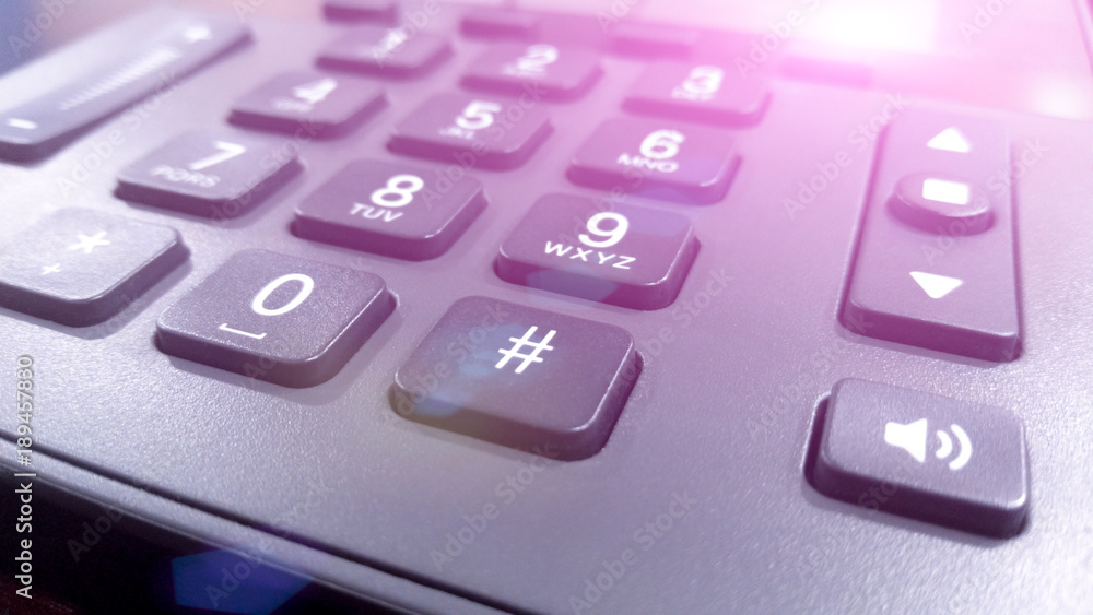 close up on the numbers on the keypad phone, fixed phone close up on the numbers on the keypad phone, fixed phone