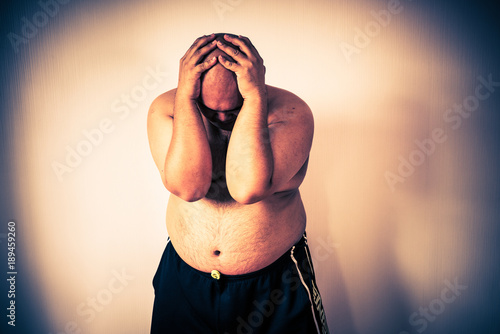 Fat man ,overweight man with big belly on white background in studio.