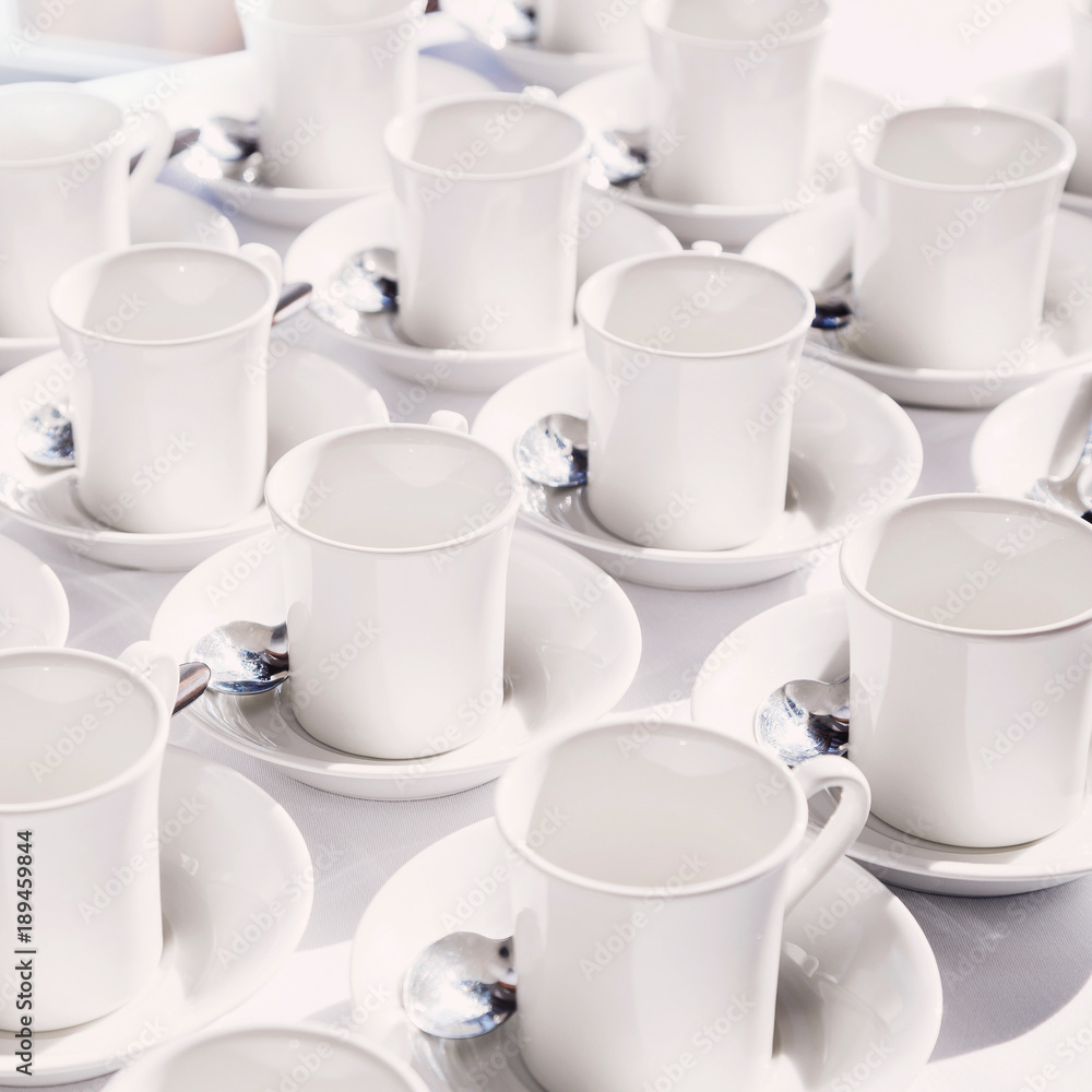 White cups arranged on the table