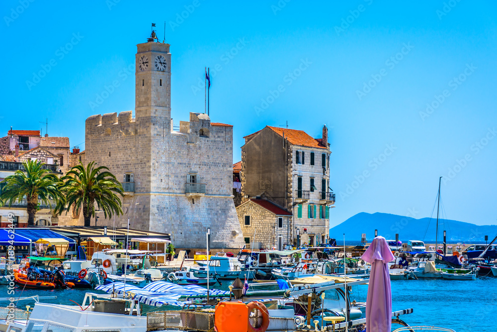 Fototapeta premium Komiza VIs summer mediterranean. / Mediterranean scenery in summer tourist resort - Komiza town on Island Vis, Southern Croatia.