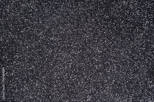 Soft rubber crumb black with white speckles texture.