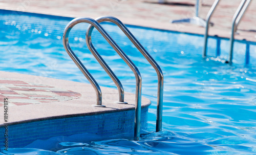 Ladder in the pool in the nature