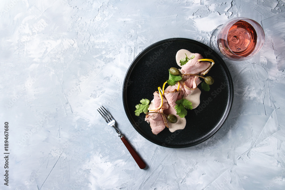 Vitello tonnato italian dish. Thin sliced veal with tuna sauce, capers