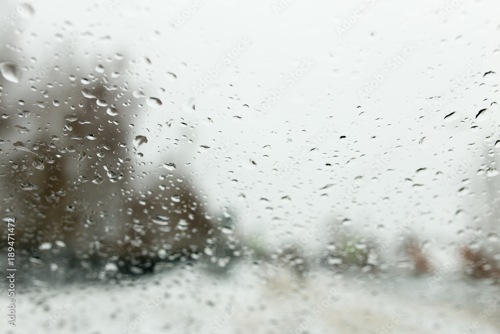 Drops on the car window in winter Drops on the car window in winter