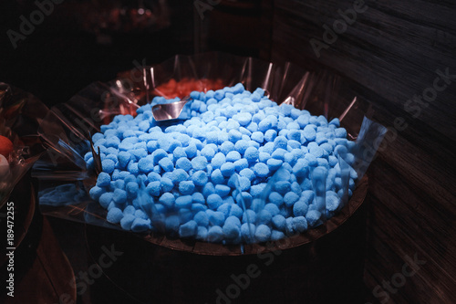 Tapeta Blue candies and sweets for sale at the market.