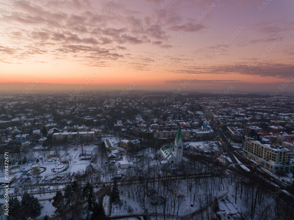 Aerial: The Kaliningrad Puppet Theatre in a public park in winter at sunset