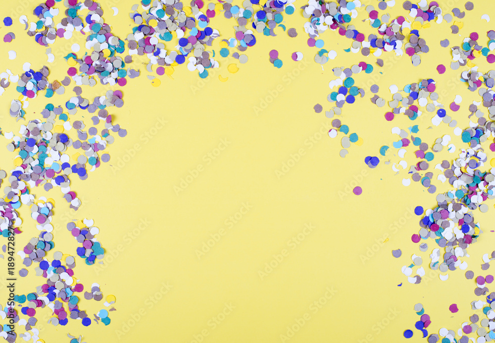 Background of yellow color, decorated celebration with confetti and balloons. Copyspace