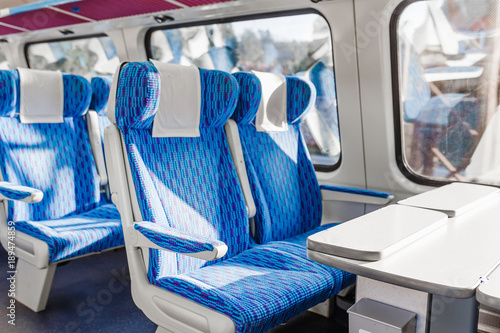 Empty seats in a luxury speed train with table