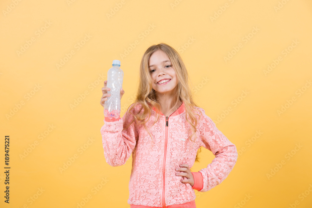 Happy little girl with water from plastic bottle Happy little girl with water from plastic bottle