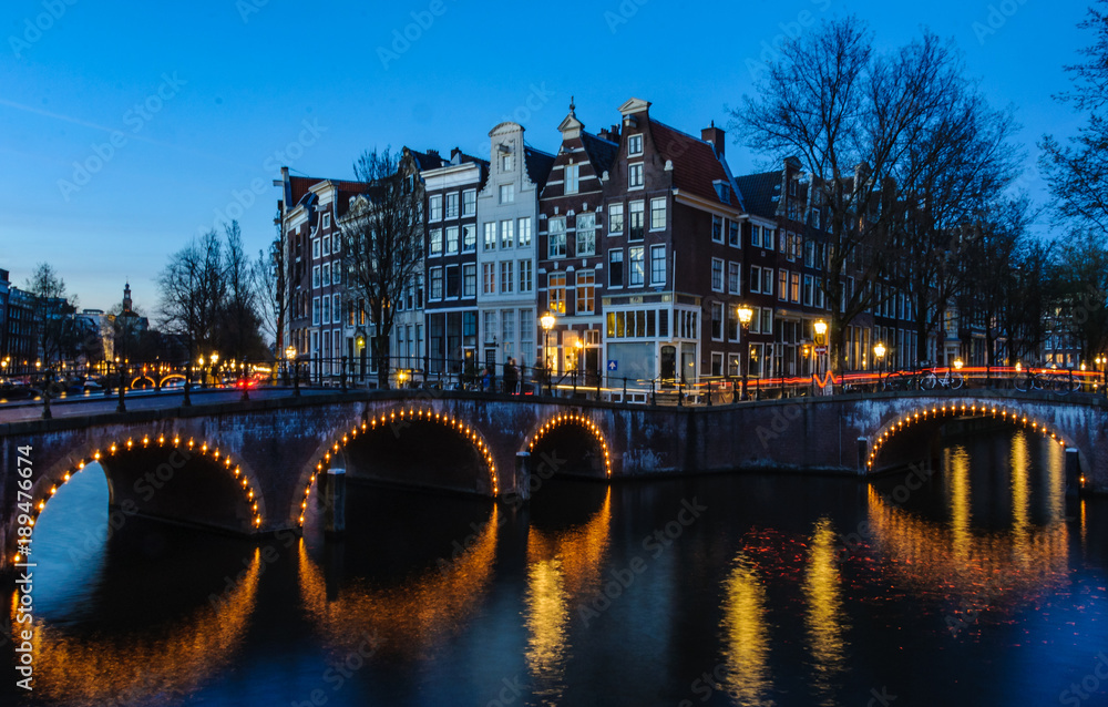 Sunset on the bridges in Canals of Amsterdam, Holland