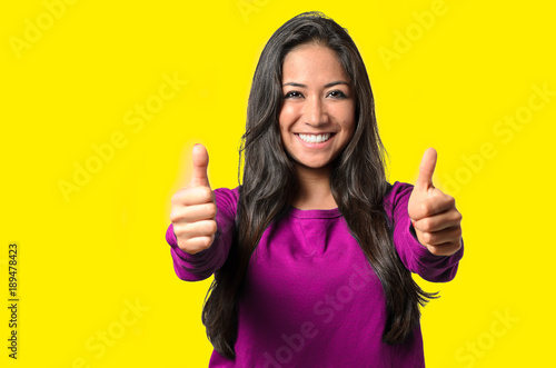 Enthusiastic motivated woman giving a thumbs up