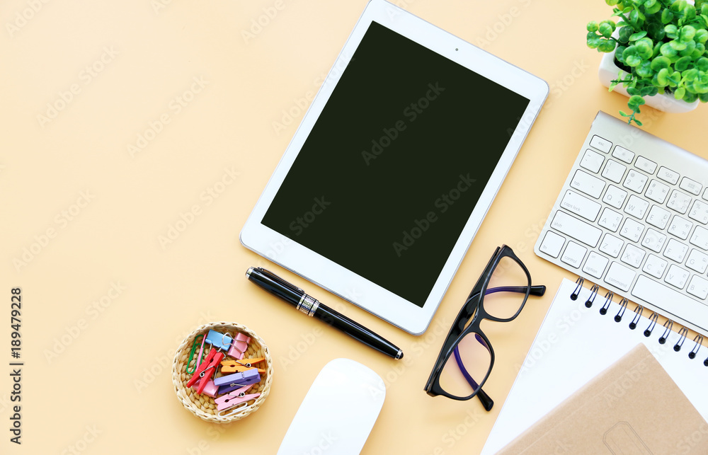 Top view tablet,glasses,mouse and keyboard on office desk.Top view with copy space. Top view tablet,glasses,mouse and keyboard on office desk.Top view with copy space.