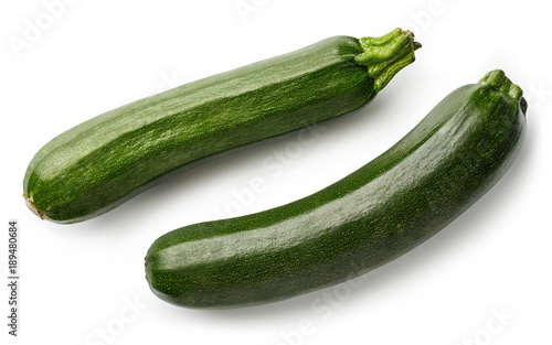 Two fresh zucchini isolated on white