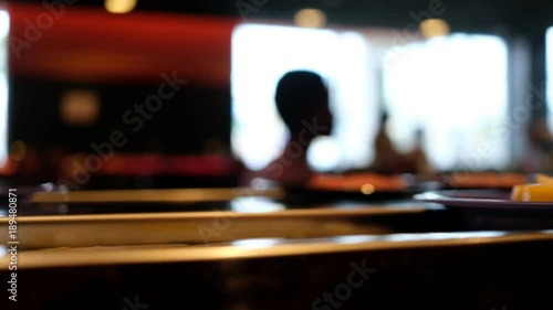 Wallpaper Mural Food running on track inside restaurant with silhouette customers Torontodigital.ca