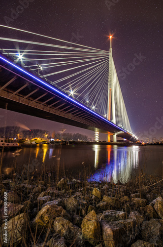 Beautiful Ada Bridge in Belgrade, Serbia under the star sky and city lights