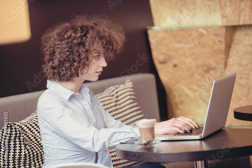 Wallpaper Mural Girl using laptop at a caffe Torontodigital.ca