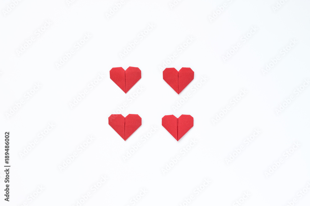 Origami hearts on a white background. Image for a gift card for the day of Valentine's Day. Minimalism