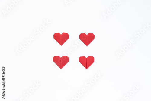 Origami hearts on a white background. Image for a gift card for the day of Valentine's Day. Minimalism