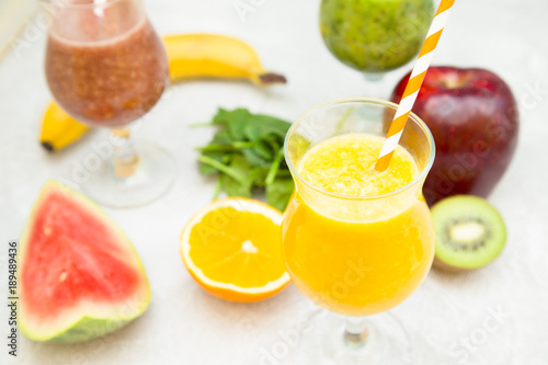 Energy and freshness for the whole day with fruit and berry smoothies with fresh kiwi, banana, orange, apple and spinach. Healthy food, Diet, Fitness concept