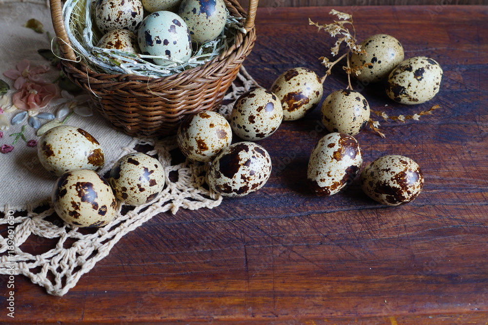 Quail eggs in a basket - Easter composition.Easter Tradition - Selective focus
Quail eggs in a basket - Easter composition.Easter Tradition - Selective focus