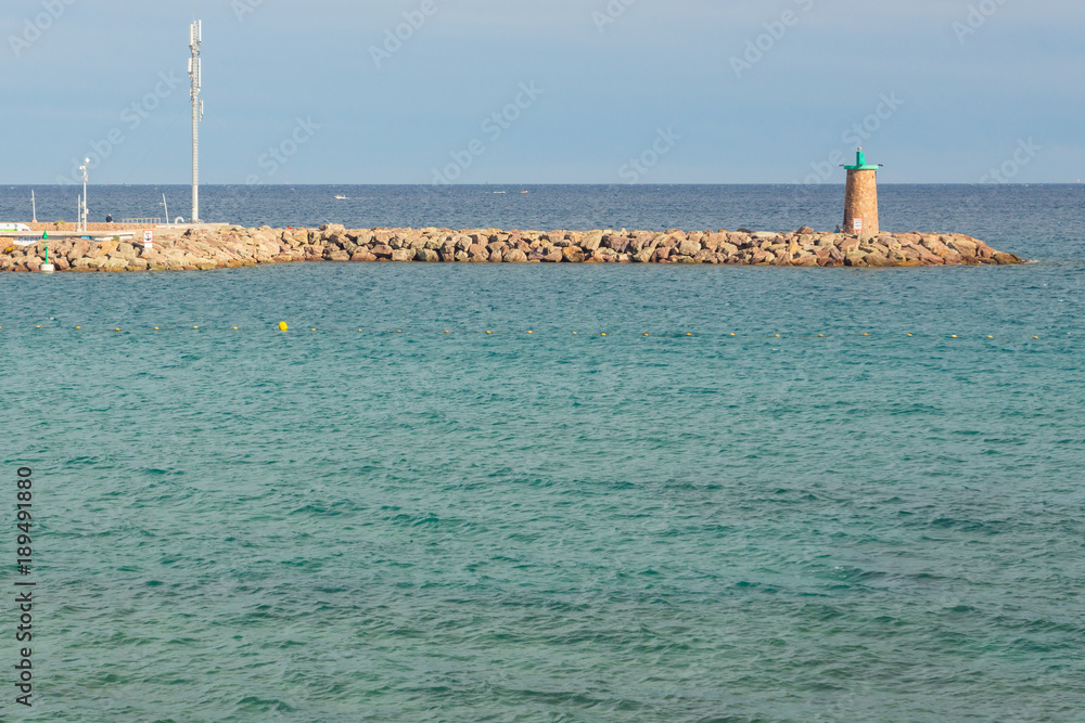 A small lighthouse of the French city Mandelieu-la-Napoule in the Mediterranean sea in Europe