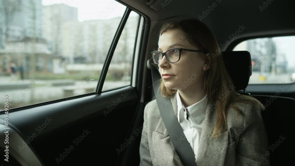 Woman Sitting in the Car and Looking Through the Window Woman Sitting in the Car and Looking Through the Window
