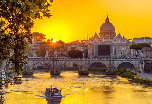 Sunset view of Basilica St Peter, bridge Sant Angelo and river Tiber in Rome. Italy photo